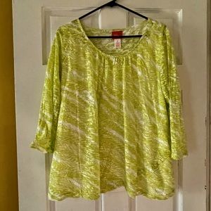 Lime green top over a white tank top